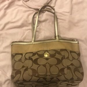Gold large Coach bag.